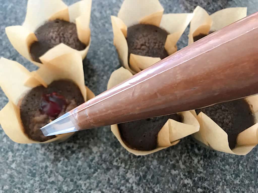 A piping bag of whipped chocolate ganache