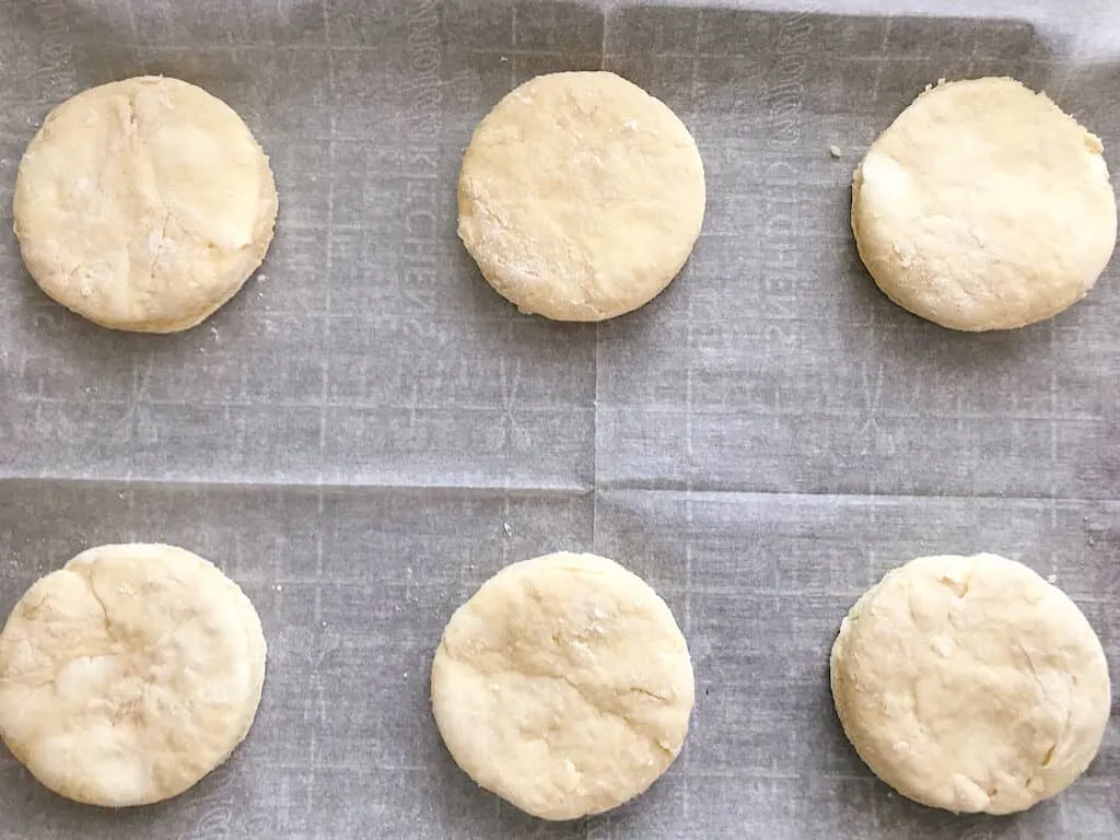 Unbaked biscuits on a baking sheet