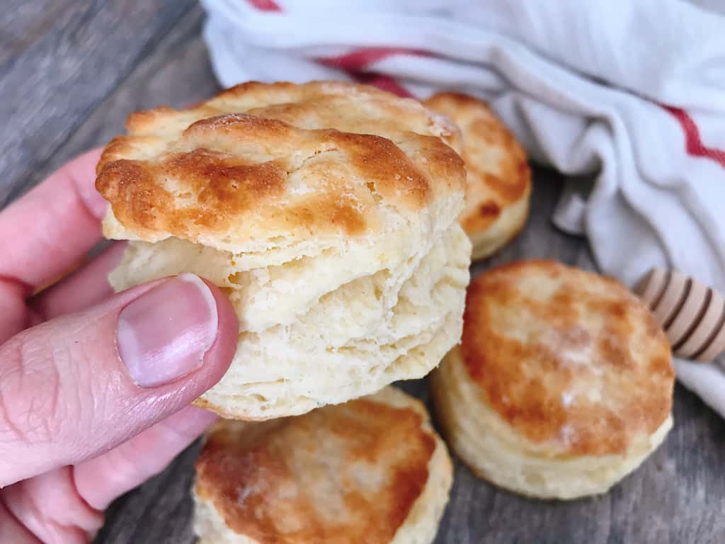 Someone holding a buttermilk biscuit