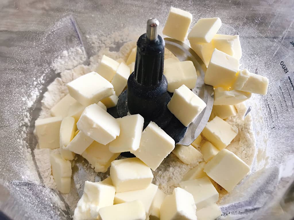 Butter and dry ingredients in a food processor.