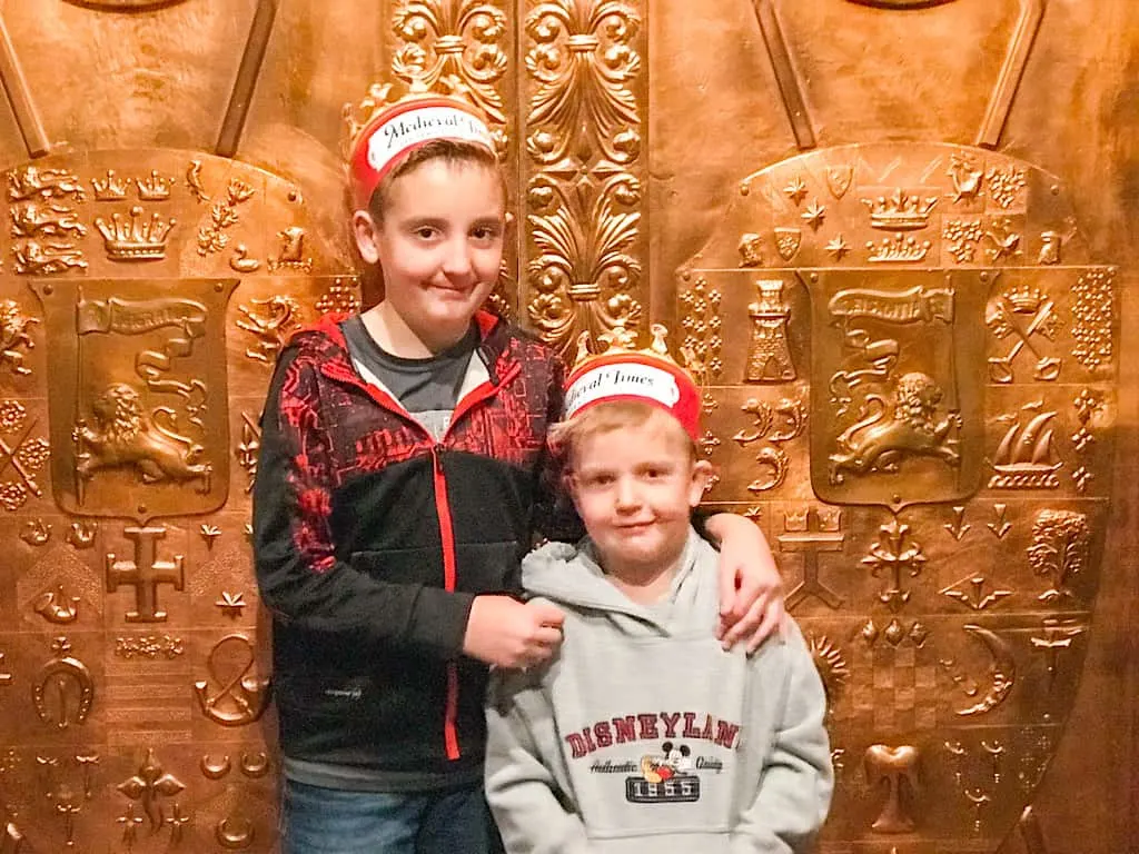 Two kids in crowns for the Medieval Times dinner show in Buena Park California