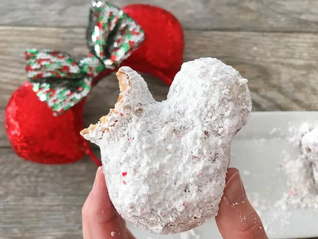 A Candy Cane Mickey Beignet and Christmas Minnie Mouse Ears