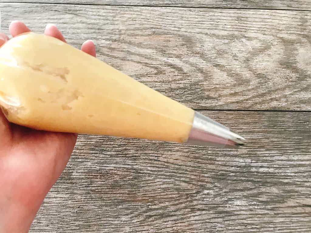 Disneyland churros dough in a piping bag