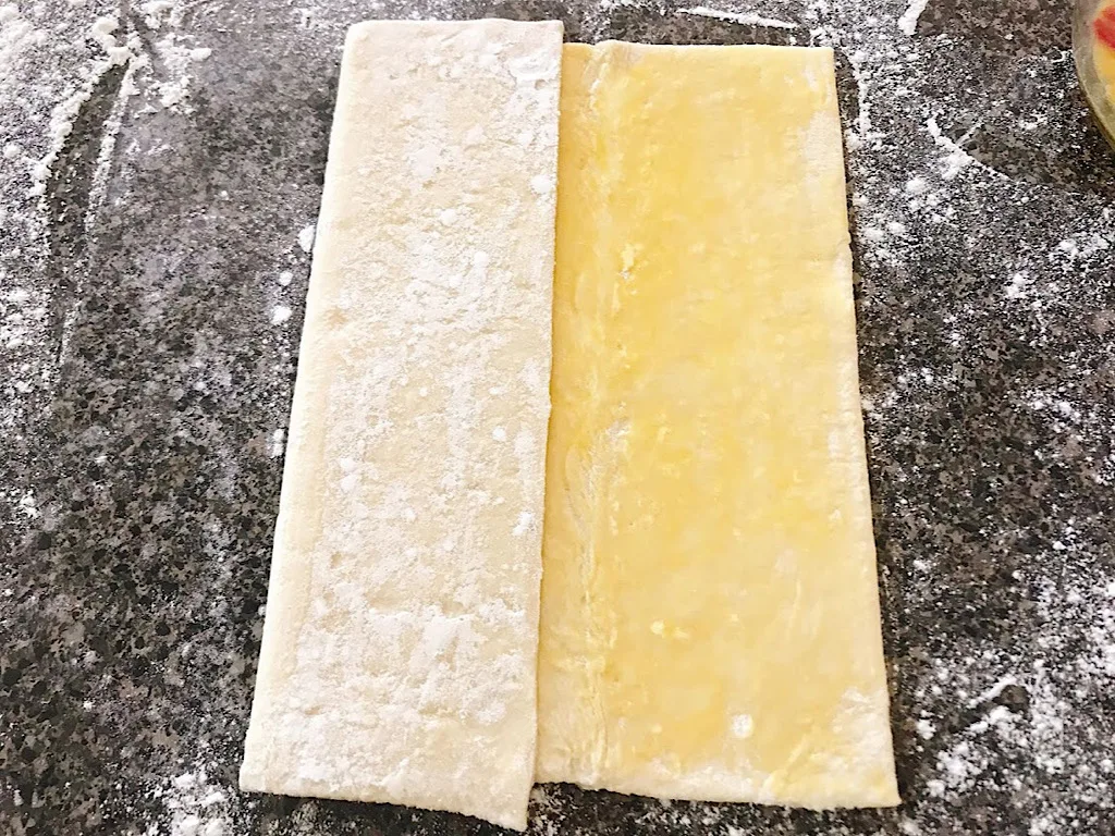 Puff pastry dough folded to make cronuts