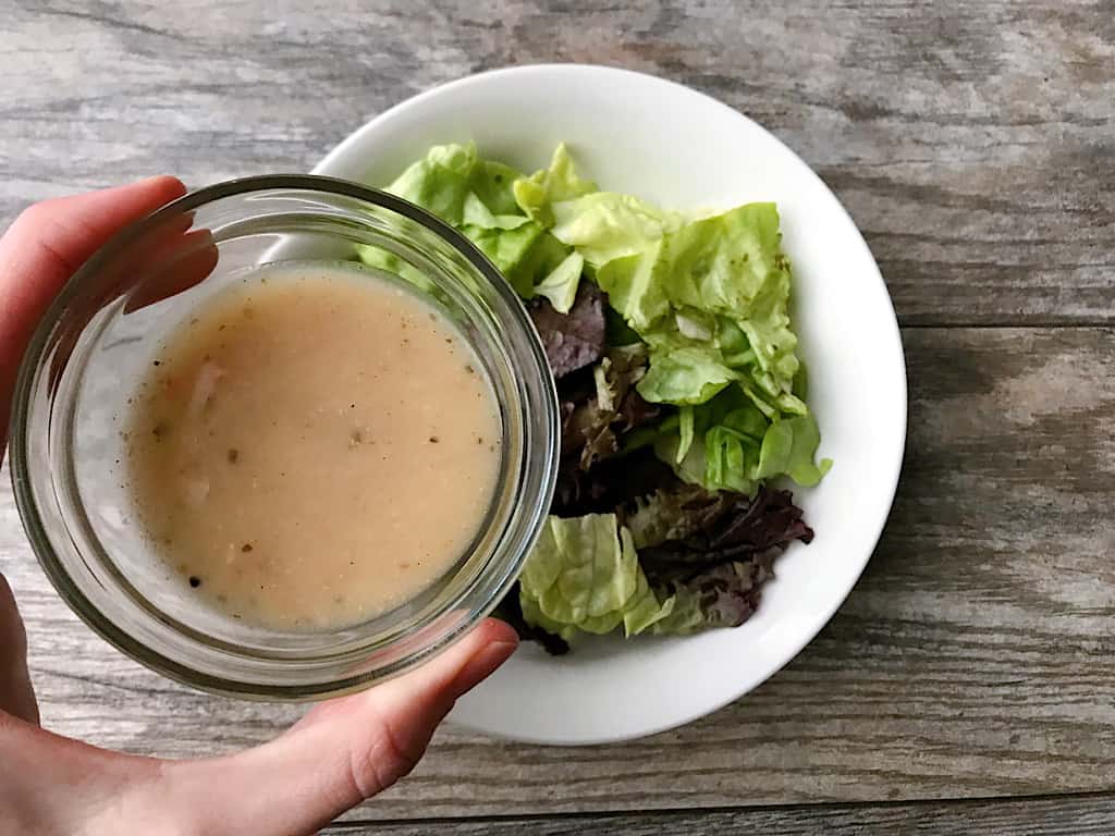 Italian Salad Dressing and lettuce in a bowl