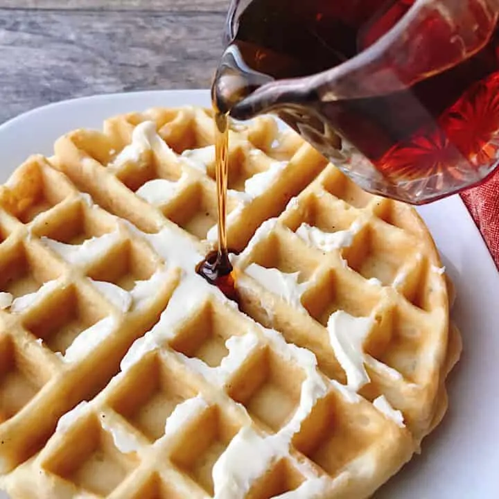 Syrup poured on a waffle