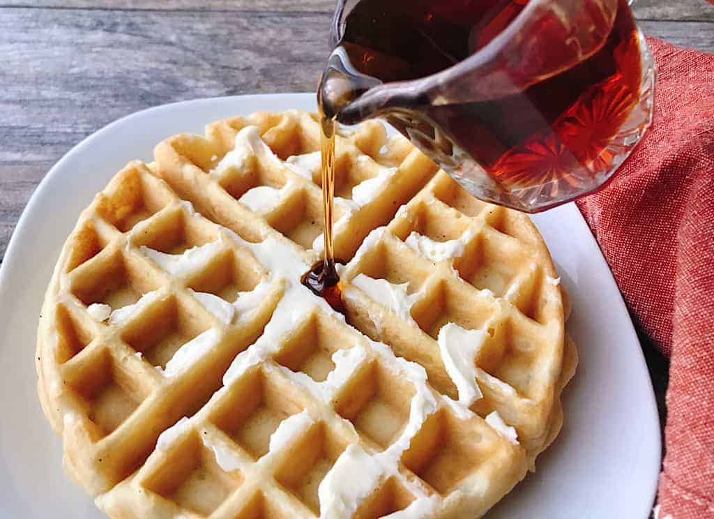 Syrup poured on a waffle