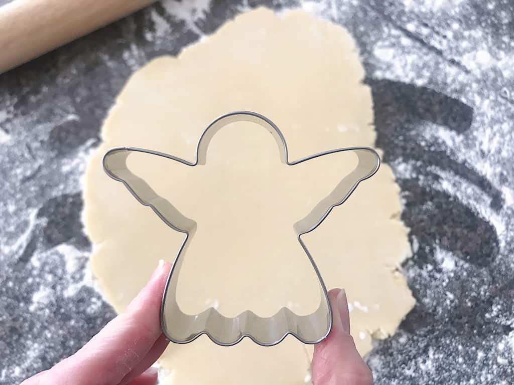 An angel cookie cutter used to make Baby Yoda cookies