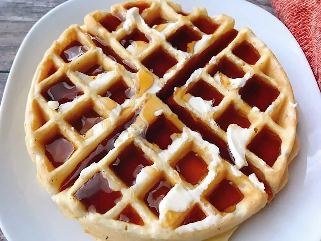 An easy fast waffle recipe with butter and syrup