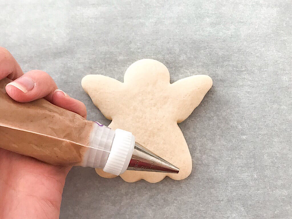Brown decorating icing in a piping bag