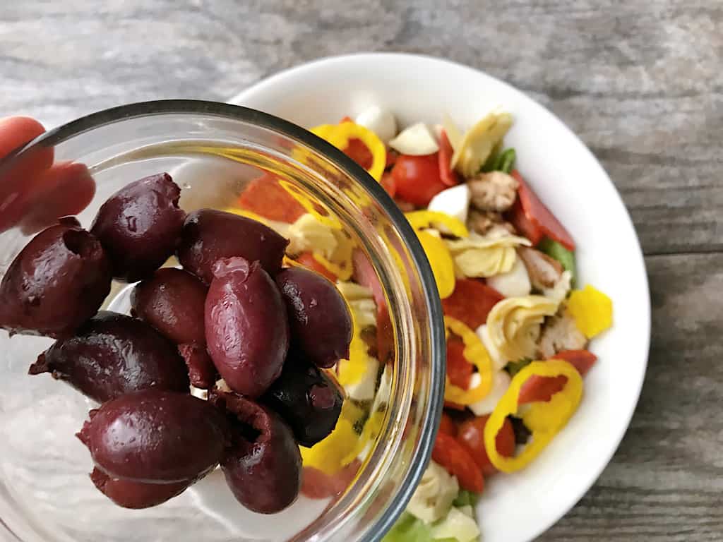 Olives and other ingredients for tossed italian salad