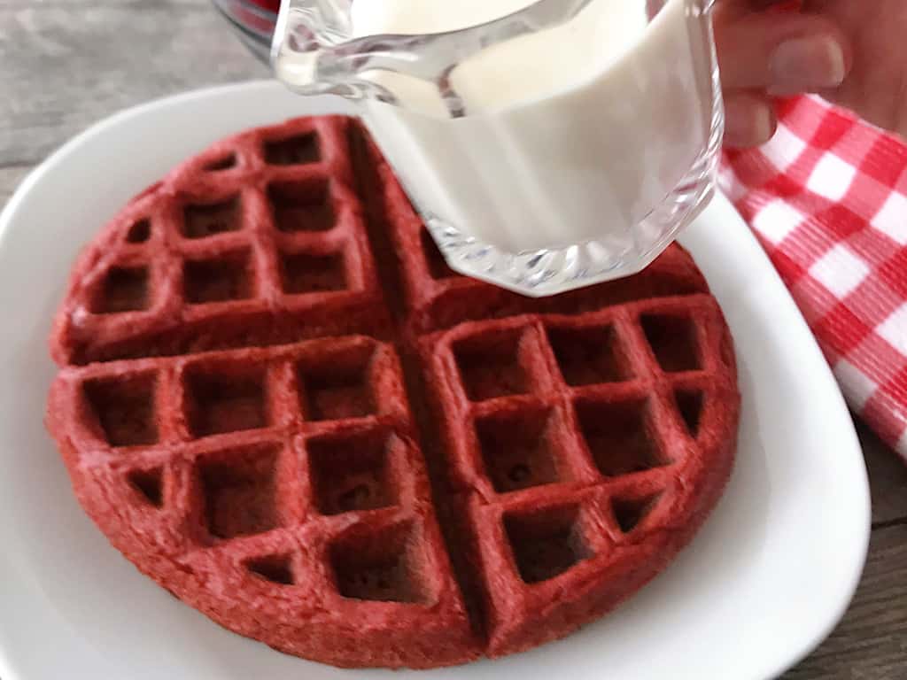 Cheesecake syrup and red velvet waffles