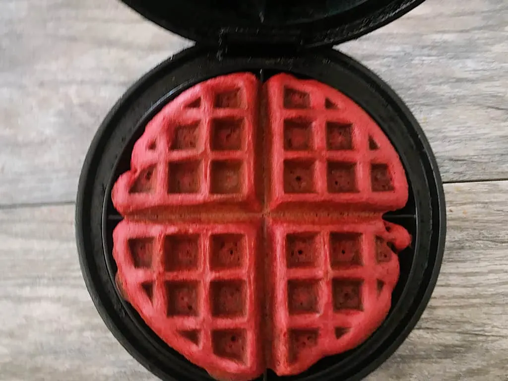 Red Velvet waffle in a waffle iron