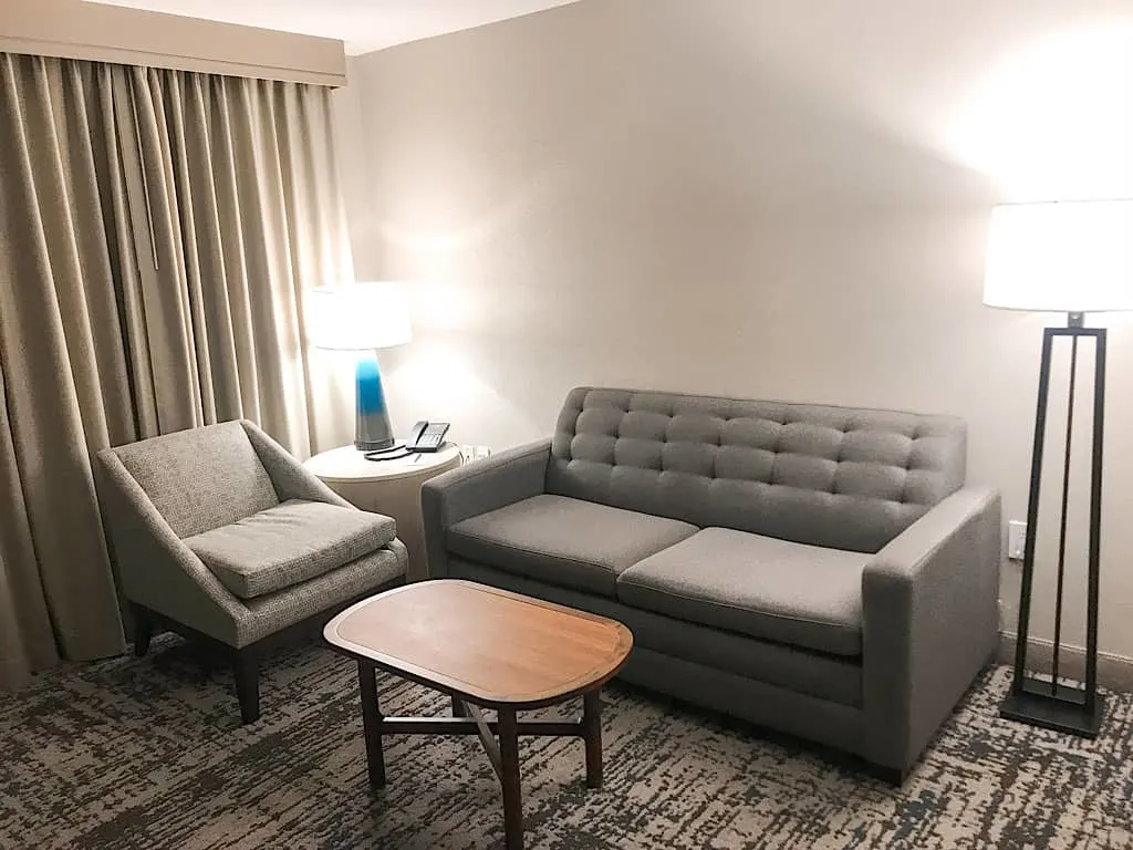Seating area of the living room in a suite at Embassy Suites Anaheim