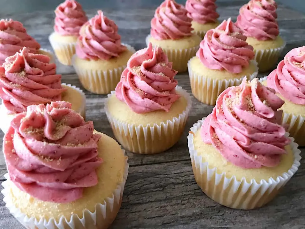 A dozen strawberry cheesecake cupcakes