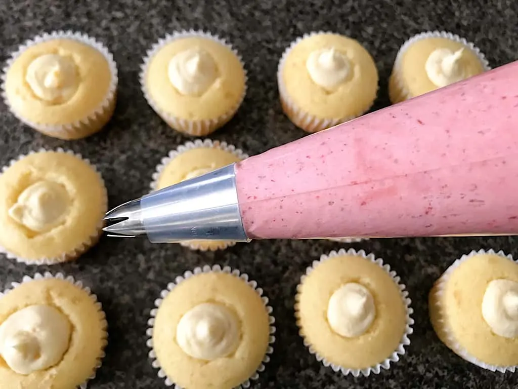 Strawberry buttercream in a piping bag