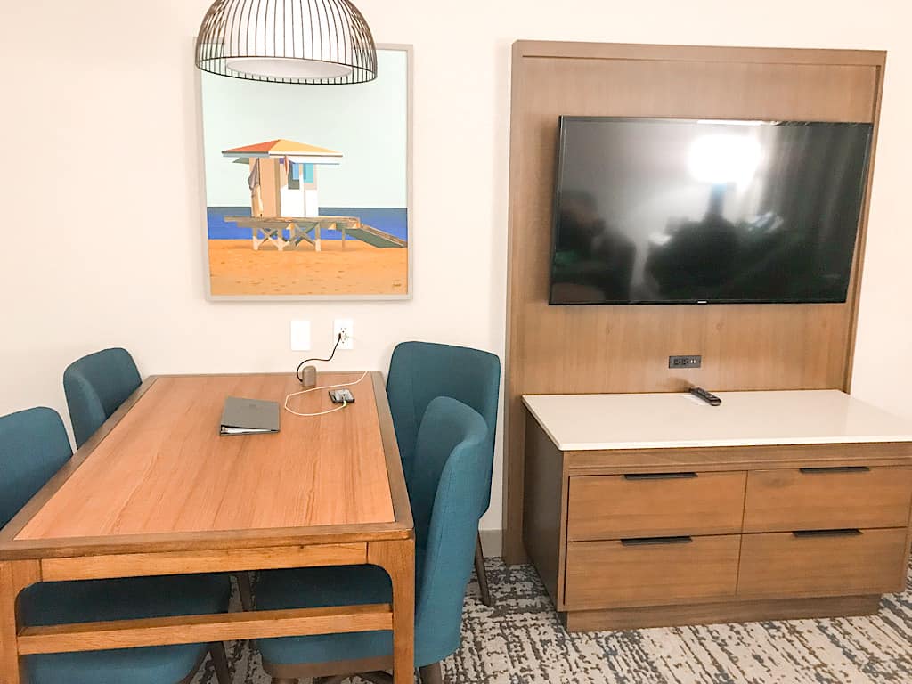 Dining area and television in living room of a suite at Embassy Suites