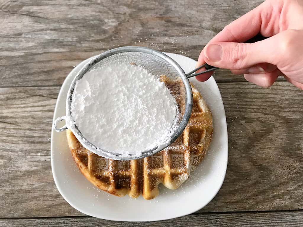 Powdered sugar on a yeast waffle