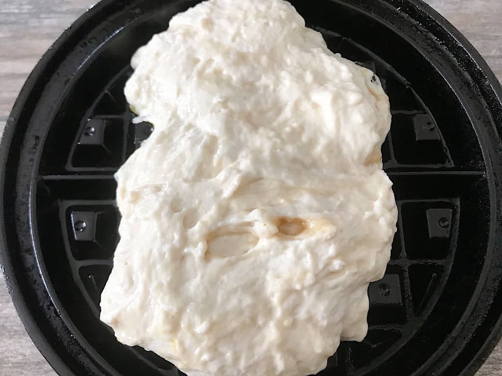 Funnel Cake Waffle batter on a waffle iron