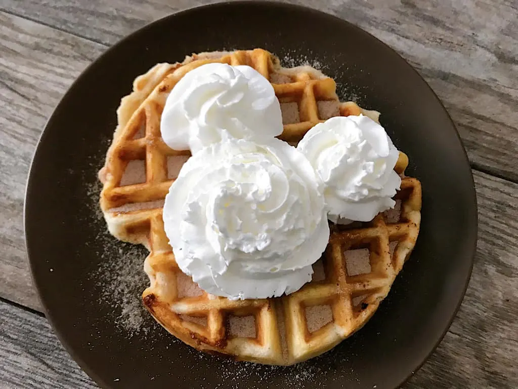 Churro funnel cake waffle with Mickey Mouse whipped cream