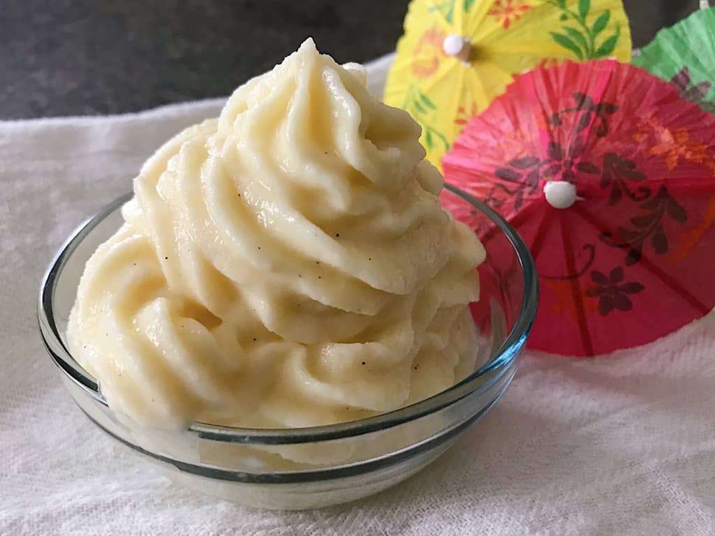 A homemade dole whip with paper umbrellas