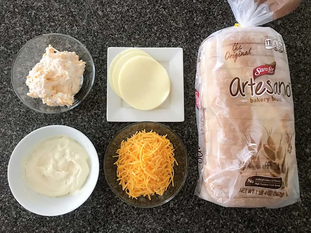 Cream cheese spread, garlic spread, provolone cheese, cheddar cheese, artisan bread for grilled cheese sandwich