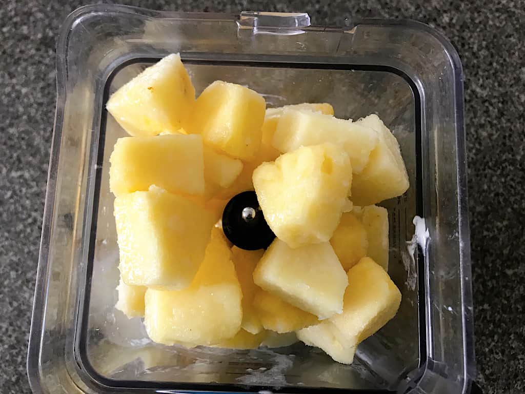 Pineapple chunks in a blender for Dole Whip