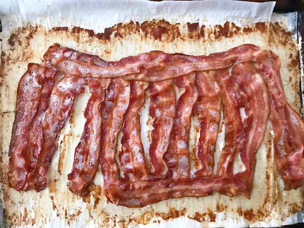 Oven baked bacon on a baking sheet