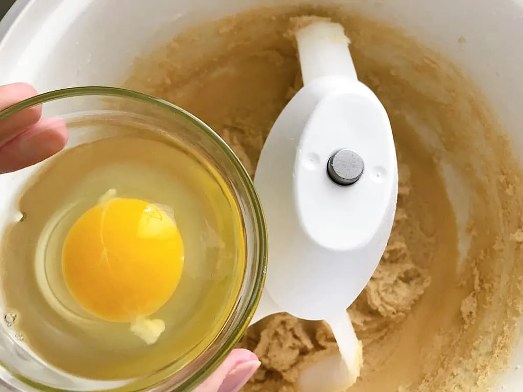 Beat in the eggs one at a time, then mix in the vanilla.