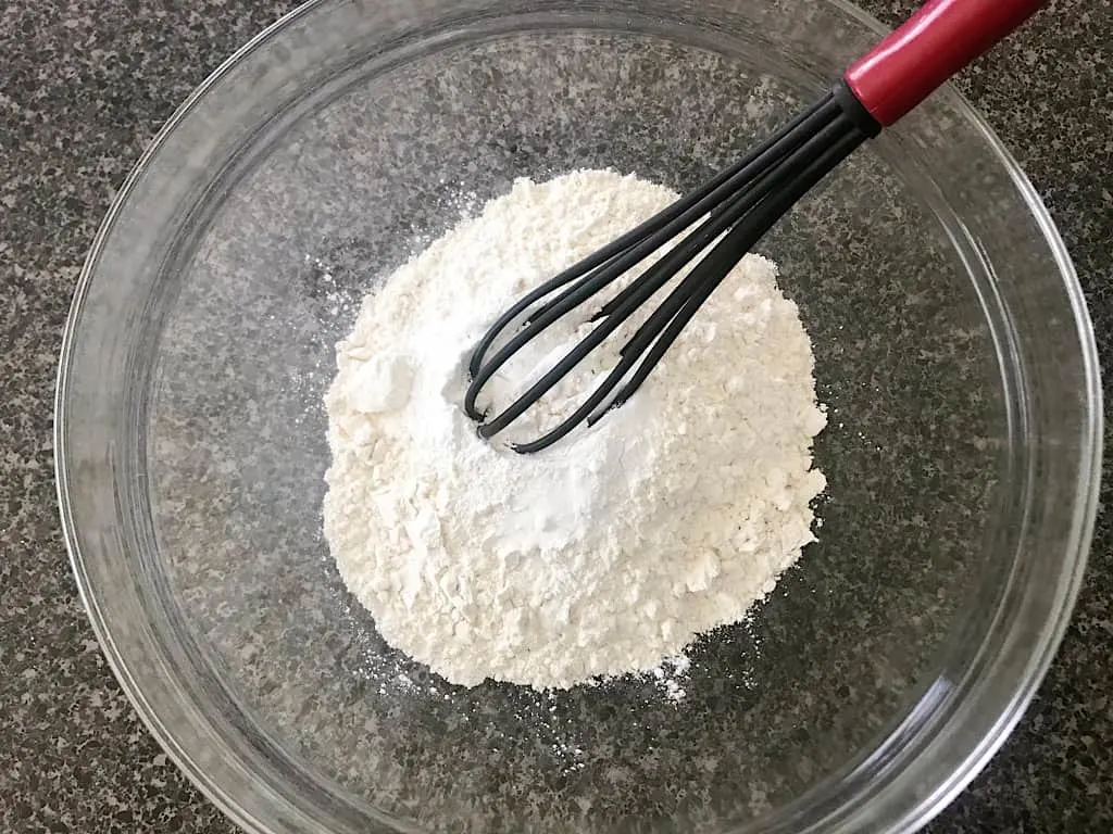 Place the flour, baking powder, and salt in a large mixing bowl and whisk together.