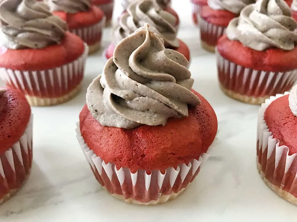 Using a circular motion, pipe the Grey Stuff onto the cupcake.