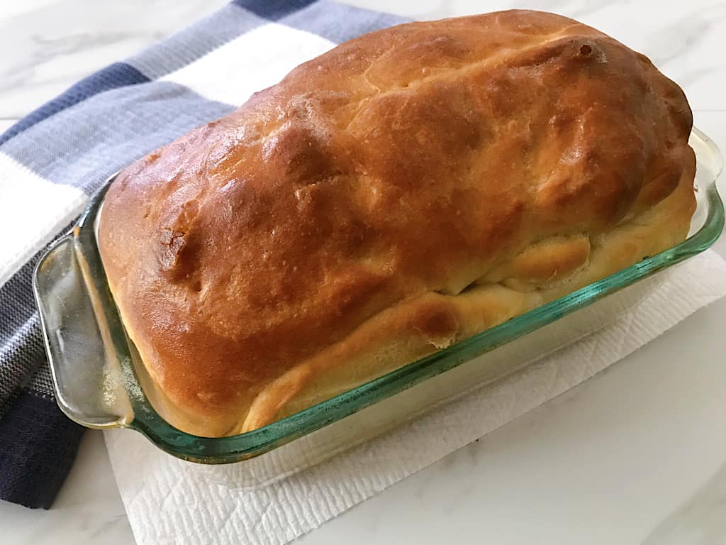 Bake at 375 degrees for 20 minutes on the lowest rack in the oven. Tent the loaf with tin foil and bake for an additional 10-15 minutes or until it is deep golden brown.