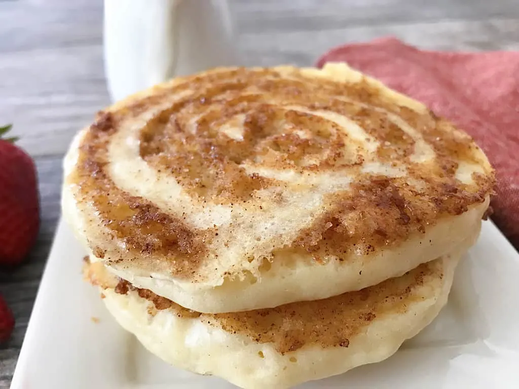 Cinnamon Roll Pancakes on a white plate