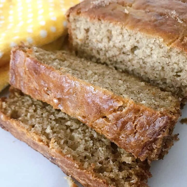 A loaf of sour cream banana bread cut into slices