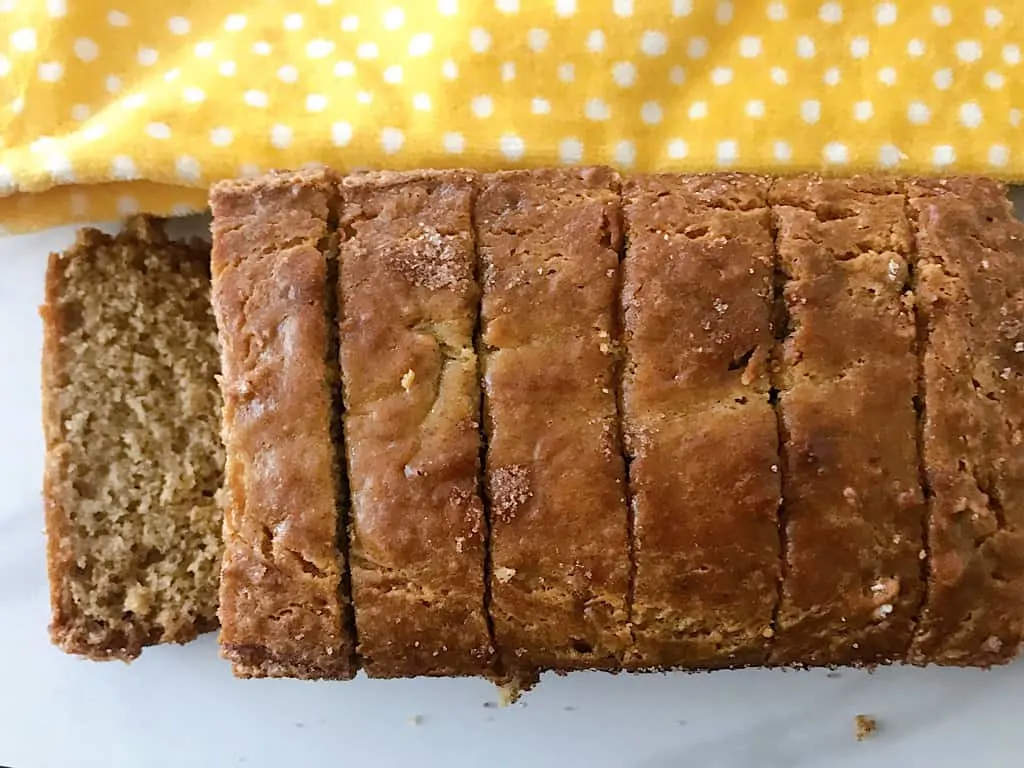 Sliced Banana Bread and a yellow kitchen towel