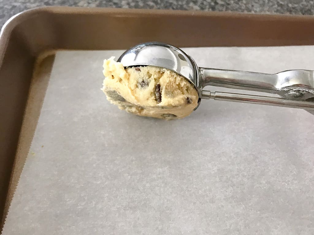 Use a 2-Tablespoon cookie scoop to scoop the dough onto a parchment paper-lined baking sheet.