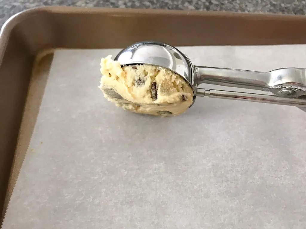 Use a 2-Tablespoon cookie scoop to scoop the dough onto a parchment paper-lined baking sheet.
