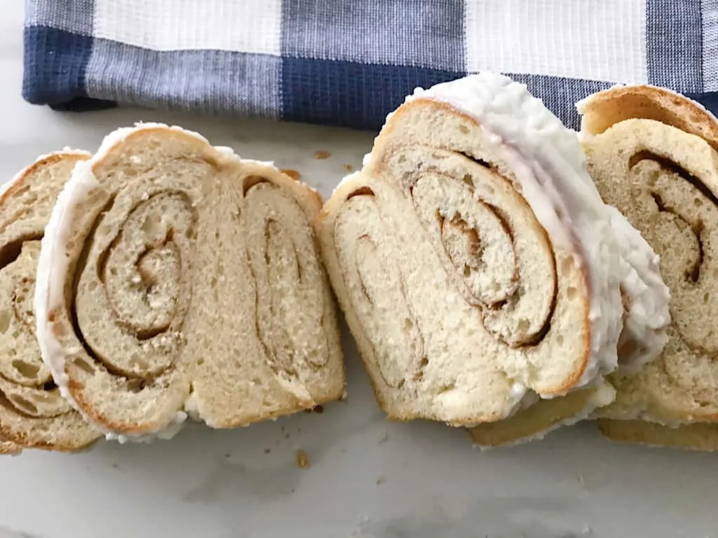 Slices of Copycat Kneader's Chunky Cinnamon Bread with icing