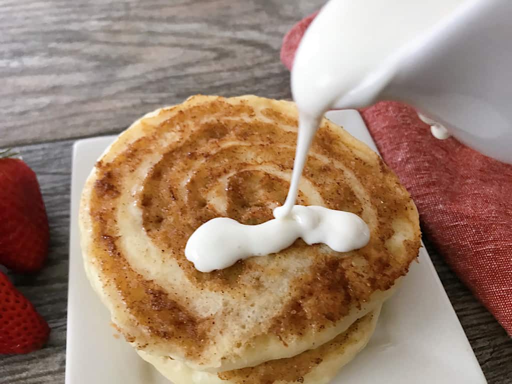 Drizzle cream cheese icing over pancakes.