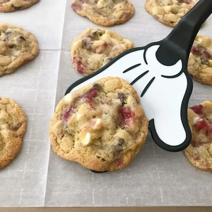 A Mickey Mouse spatula with Disneyland's Raspberry White Chocolate Chip Cookies