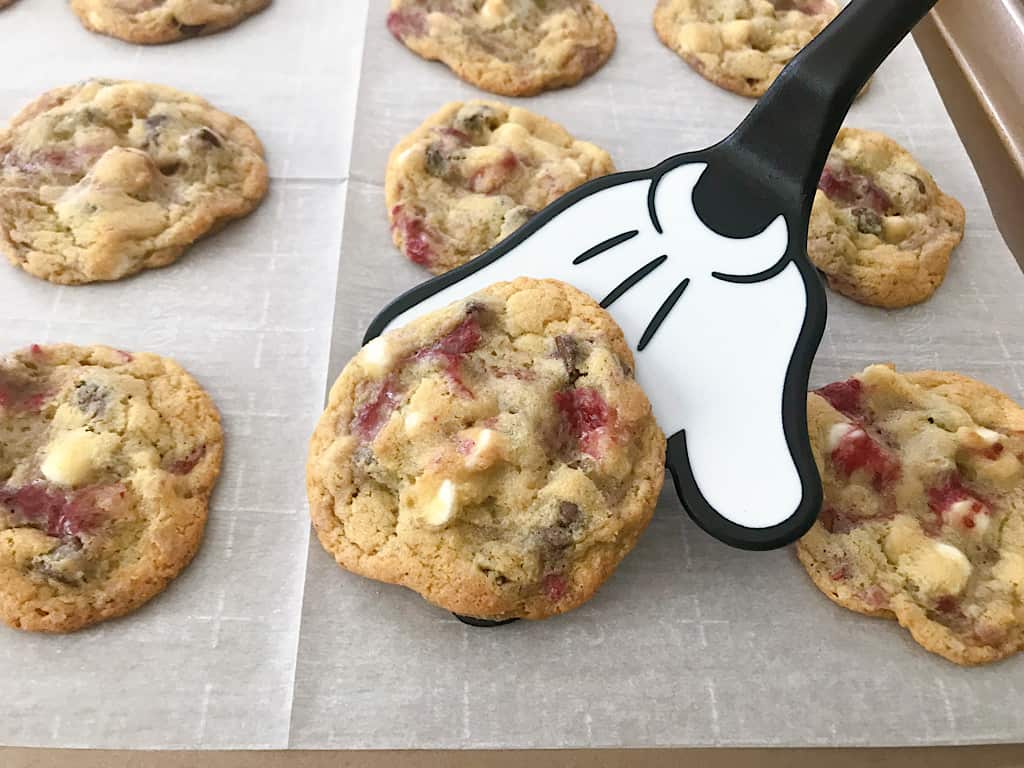 A Mickey Mouse spatula with Disneyland's Raspberry White Chocolate Chip Cookies