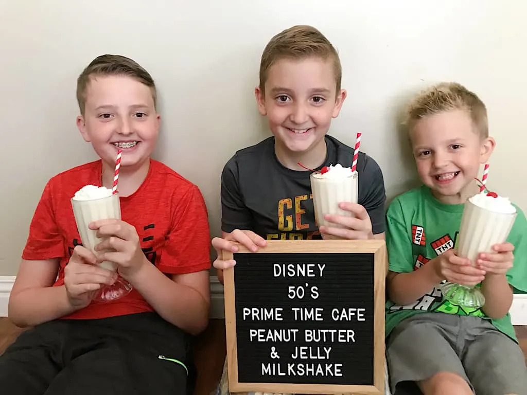 Three kids drinking peanut butter and jelly milkshakes