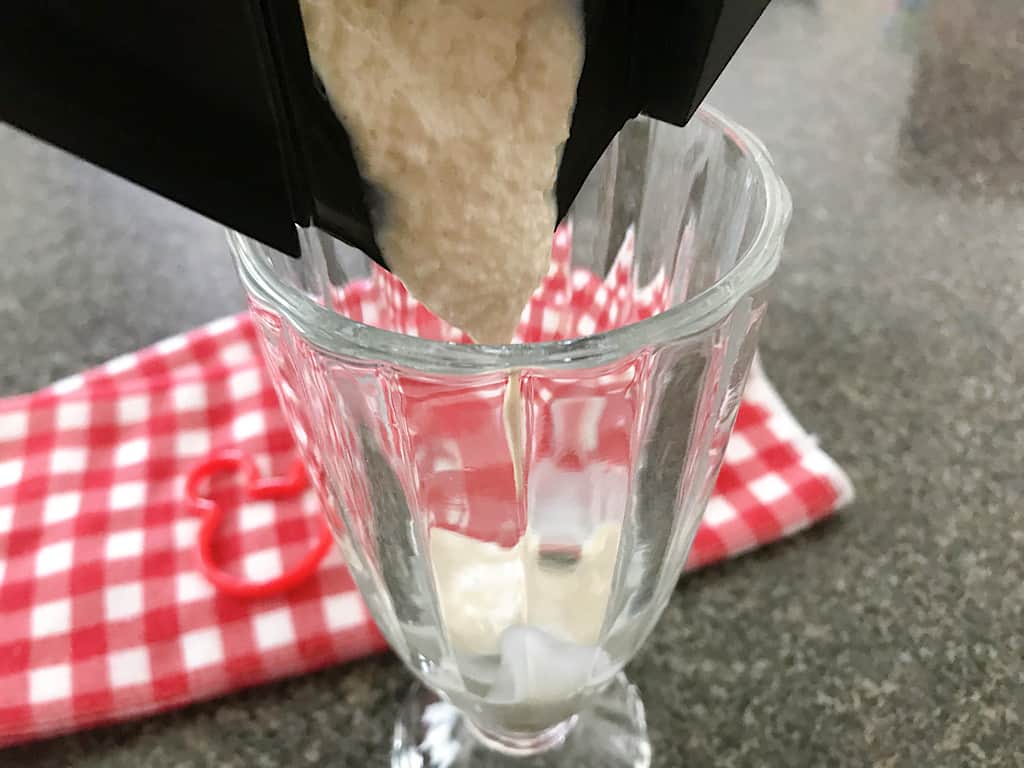 Pour the milk shake into a cute milkshake glass and add a fun straw.