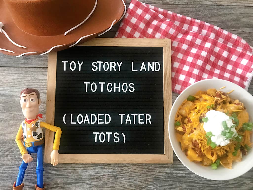 A letter board that says Toy Story Land Totchos (Loaded Tater Tots)