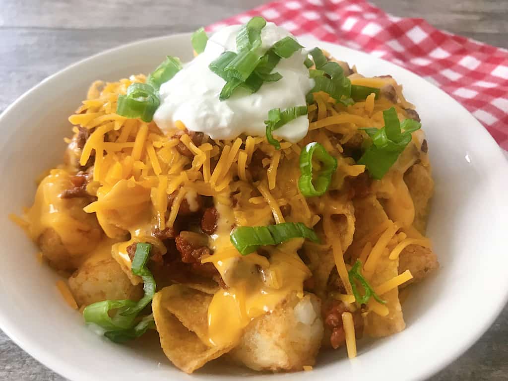 A copycat recipe of Woody's Lunch Box Totchos, or Loaded Tater Tots available at Disney World inside Toy Story Land. A bowl of pure comfort!