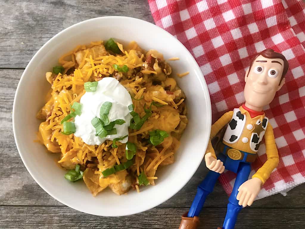 A bowl of Disney World Totchos and a Woody doll