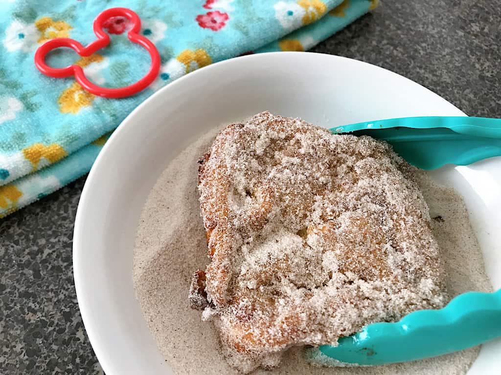 Coat both sides of the Tonga Toast with cinnamon sugar.