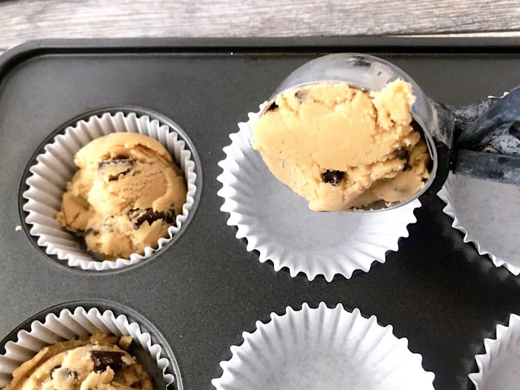 Add paper liners to a muffin pan.