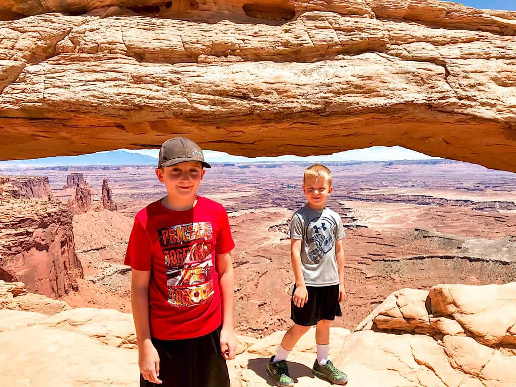 Kids at Mesa Arch in Canyonlands National Park