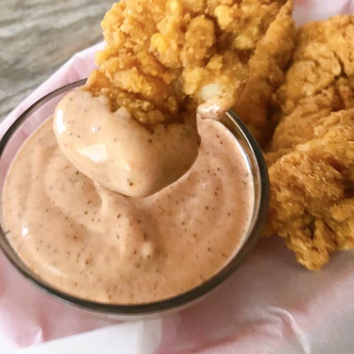 chicken dipped in Raising Cane's Sauce sauce